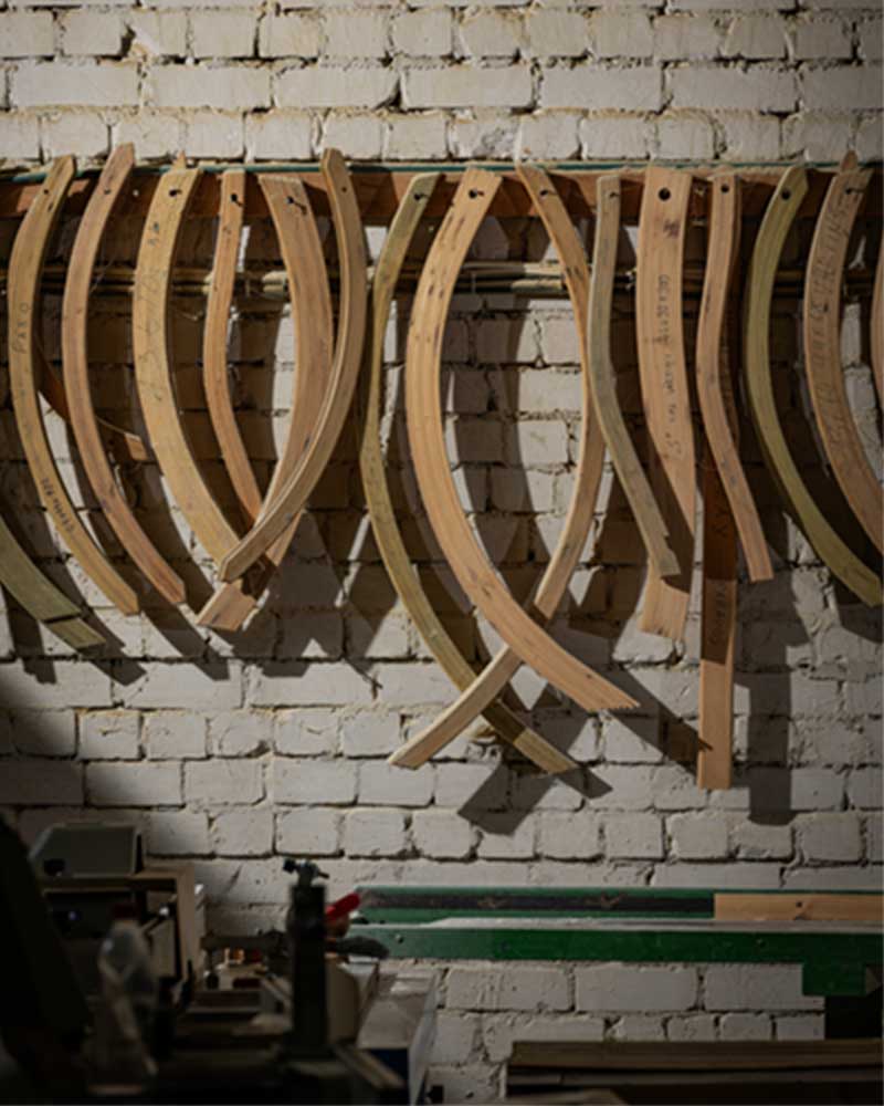 Wooden elements hanging on a white brick wall