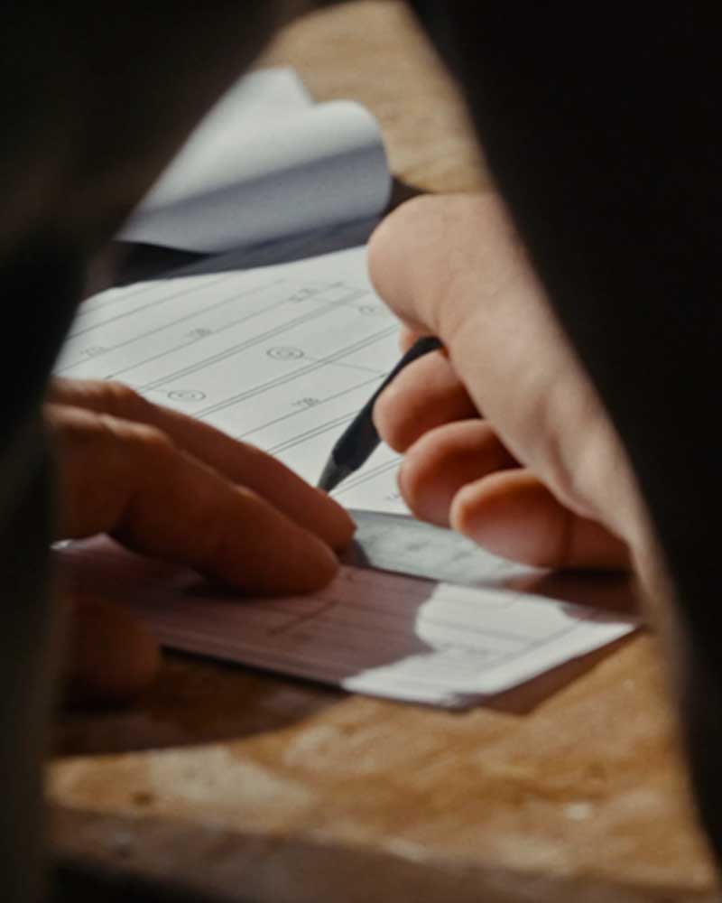 Man drawing detailed wood design