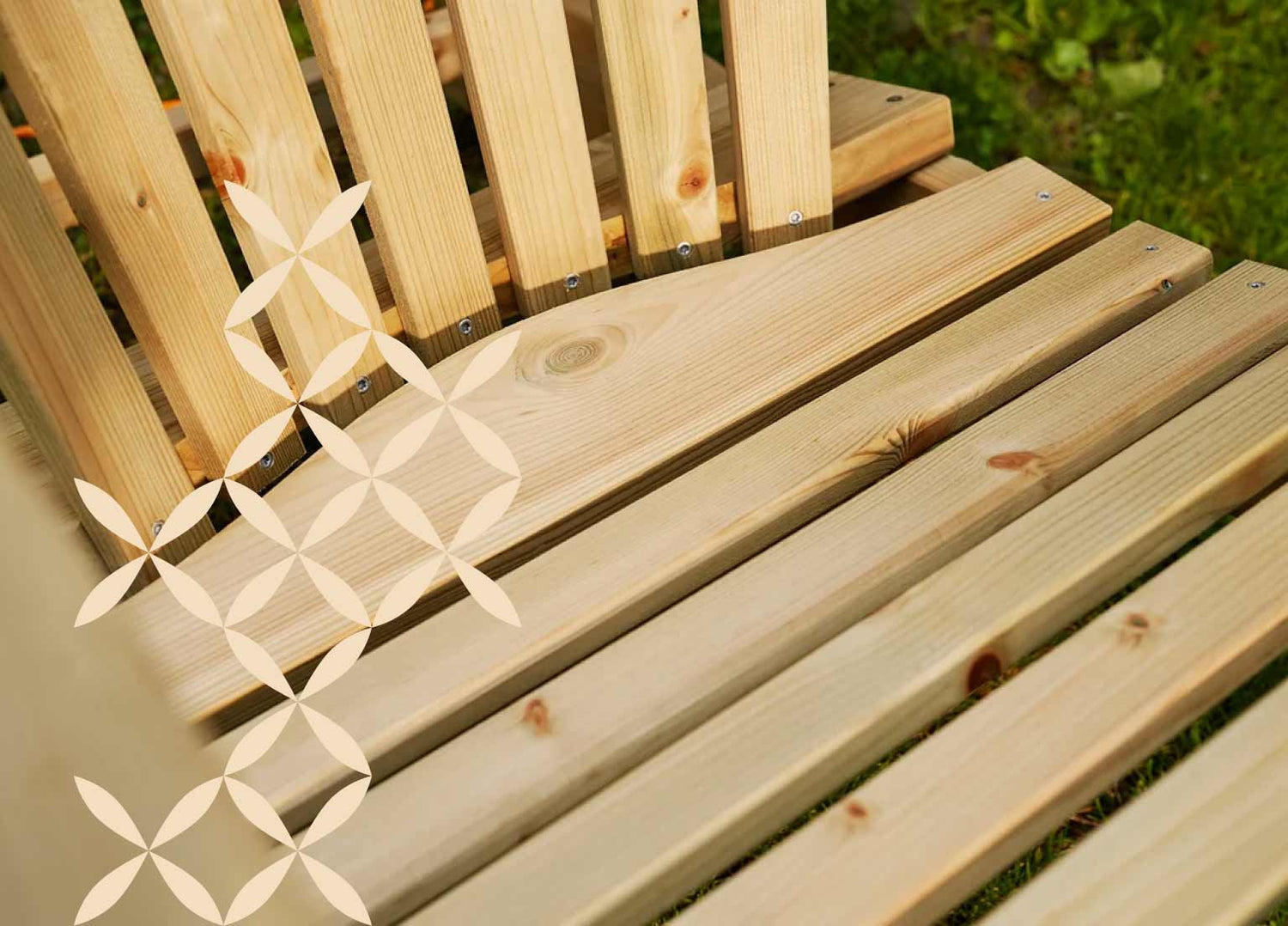 Closeup of the seating area of the green Adirondack garden chair