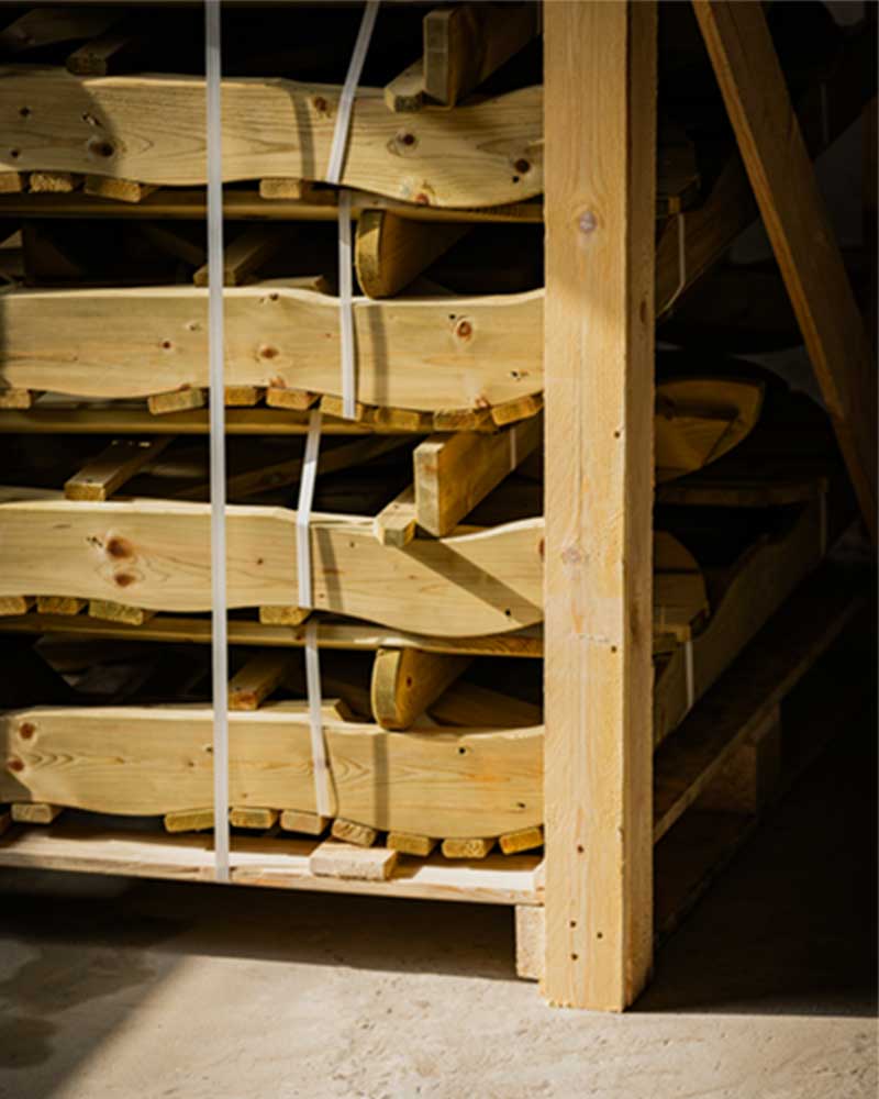 A closeup of wood furniture pieces, assembled for storage