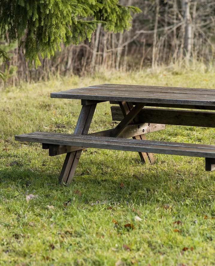 A-frame wooden picnic table's fading colors