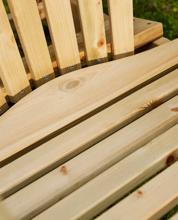 Closeup of wooden knots in a garden chair