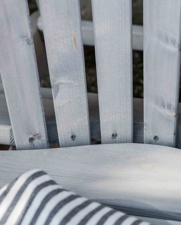 Example photo of wood resin pockets in a grey garden chair